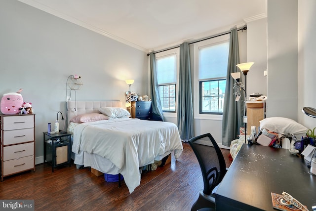 bedroom featuring ornamental molding and dark hardwood / wood-style flooring