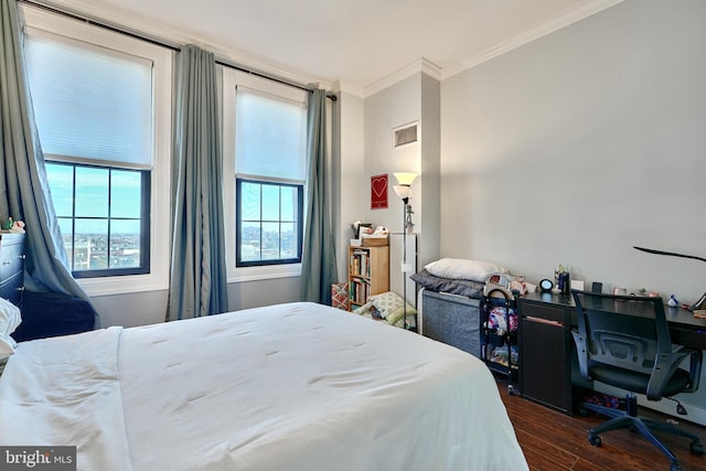 bedroom with dark wood-type flooring and ornamental molding