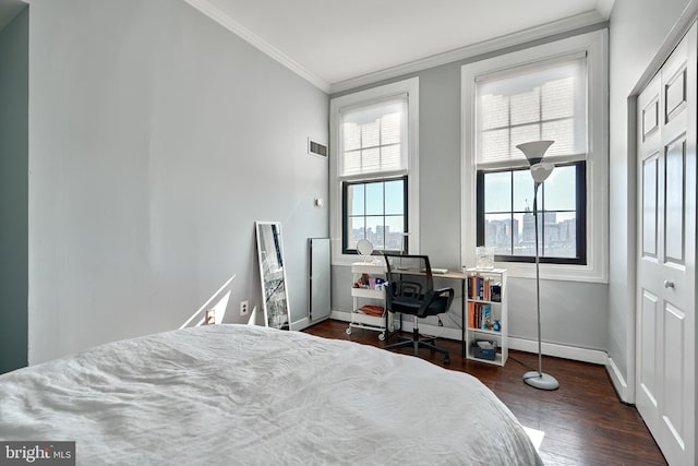 bedroom featuring dark wood-type flooring and ornamental molding