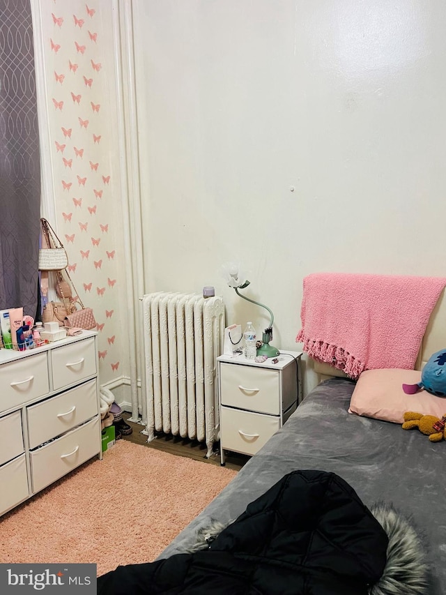 bedroom featuring radiator heating unit