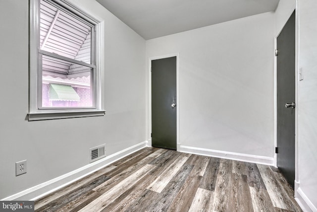 empty room featuring dark hardwood / wood-style floors