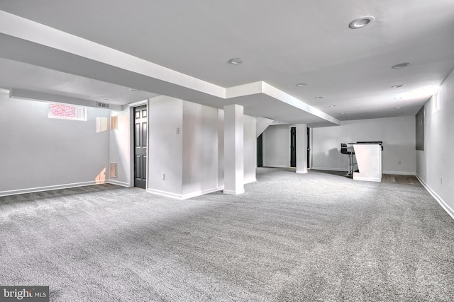 basement featuring carpet flooring