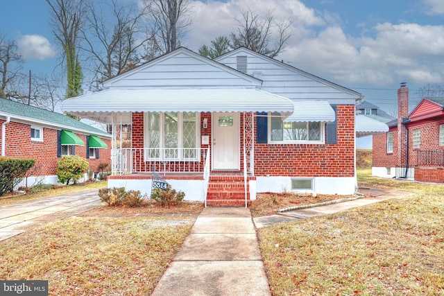 bungalow with a front yard