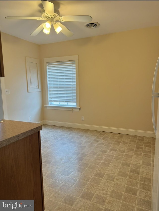 empty room featuring ceiling fan