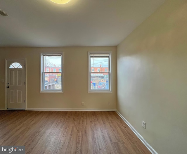 foyer entrance with light wood-type flooring