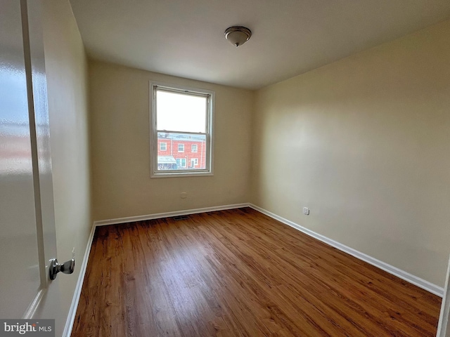 spare room featuring hardwood / wood-style flooring