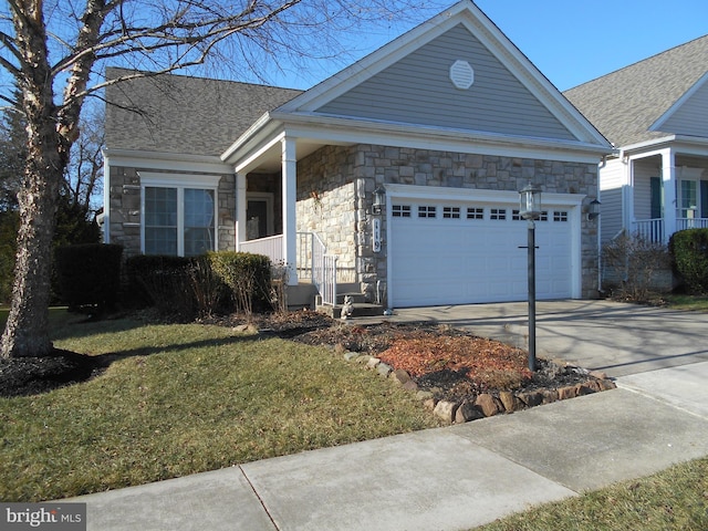 view of front of house featuring a garage and a front yard