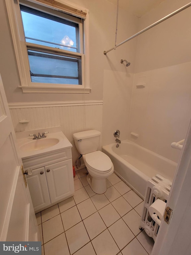 full bathroom featuring tile patterned floors, toilet, shower / bathtub combination, vanity, and radiator