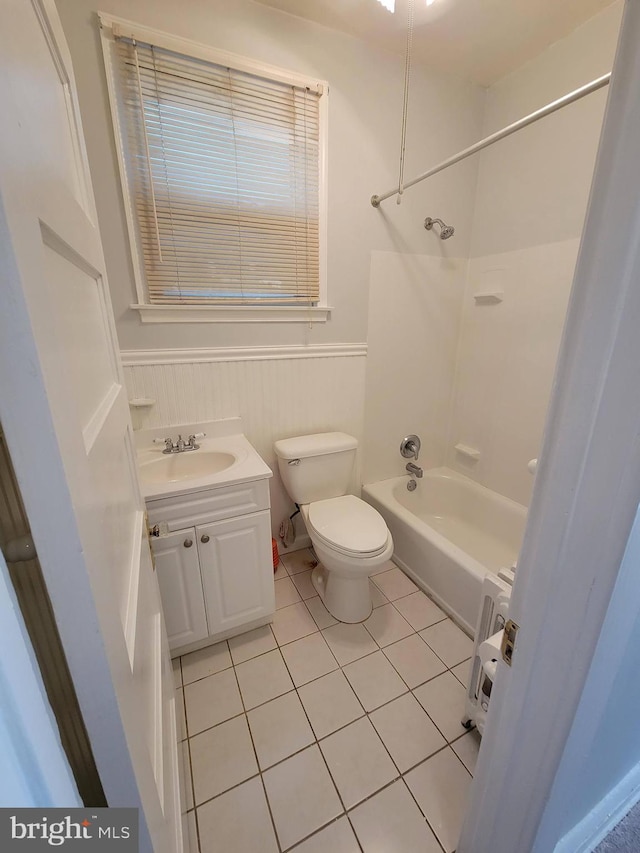 full bathroom with tile patterned flooring, vanity, toilet, and washtub / shower combination