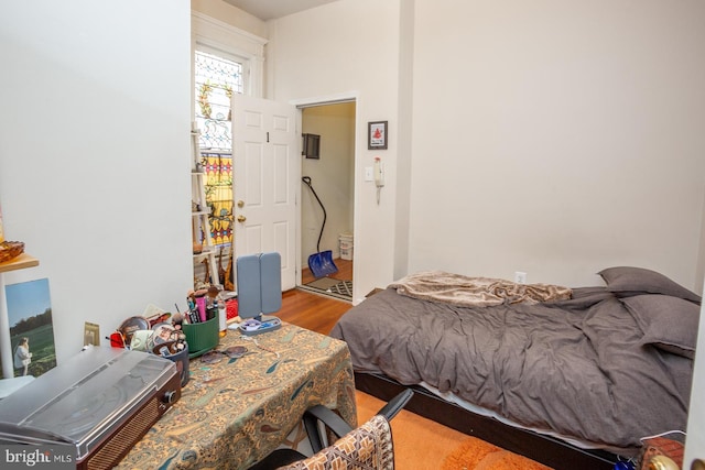 bedroom with wood finished floors