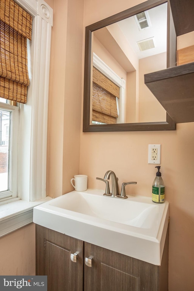 bathroom featuring vanity and visible vents