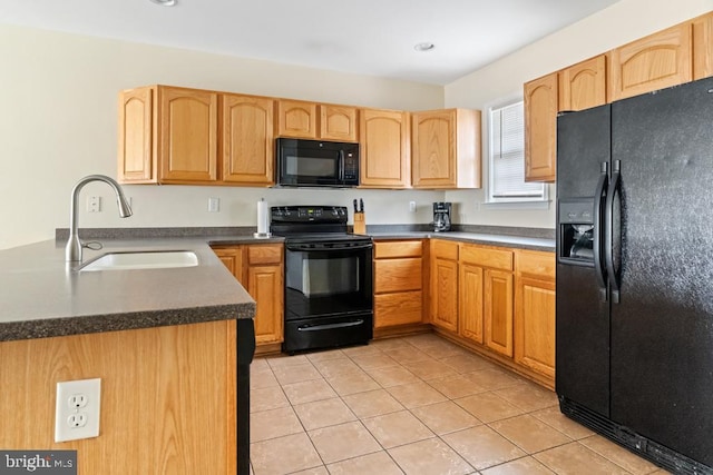 kitchen with sink, light tile patterned floors, and black appliances