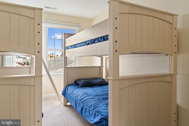 bedroom with light colored carpet