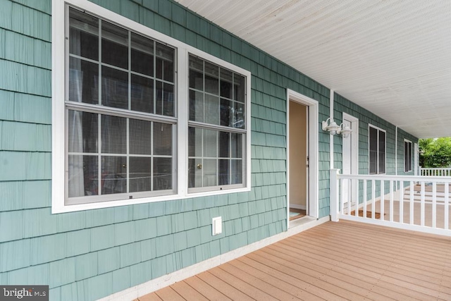 wooden terrace with a porch