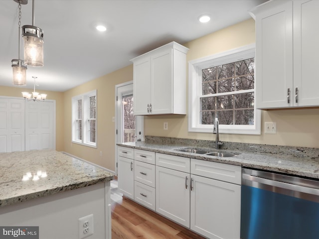 kitchen with white cabinetry, sink, pendant lighting, and dishwasher