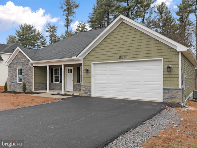 view of front of house featuring a garage and covered porch