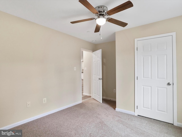 unfurnished bedroom with light carpet and ceiling fan