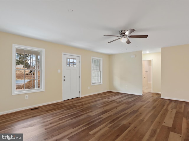 foyer featuring ceiling fan and dark hardwood / wood-style flooring