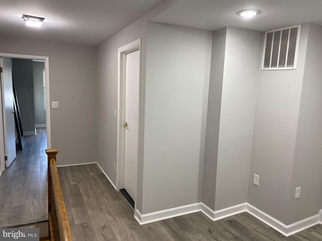 corridor featuring hardwood / wood-style floors