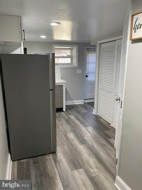 kitchen featuring dark hardwood / wood-style floors and appliances with stainless steel finishes