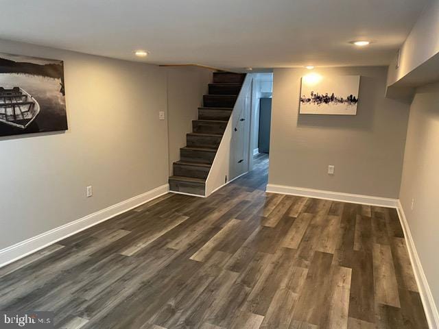 basement featuring dark hardwood / wood-style floors