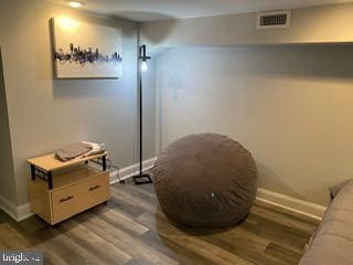 living area with dark hardwood / wood-style flooring