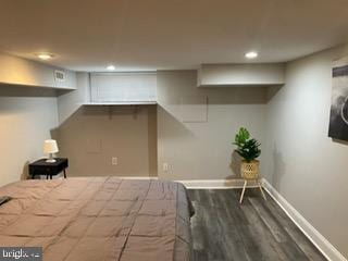 bedroom featuring dark wood-type flooring