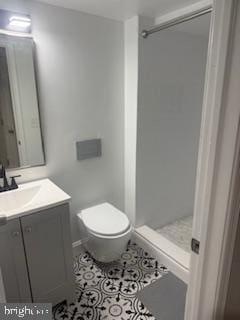 bathroom featuring walk in shower, tile patterned floors, toilet, and vanity