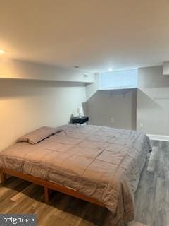 bedroom featuring wood-type flooring