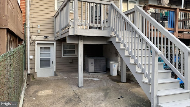 entrance to property with central AC and a patio