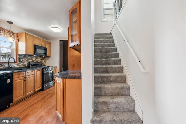 staircase with wood finished floors