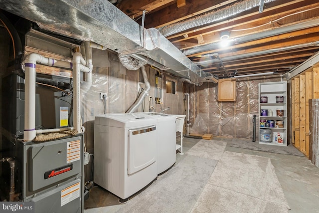 unfinished basement with heating unit and independent washer and dryer