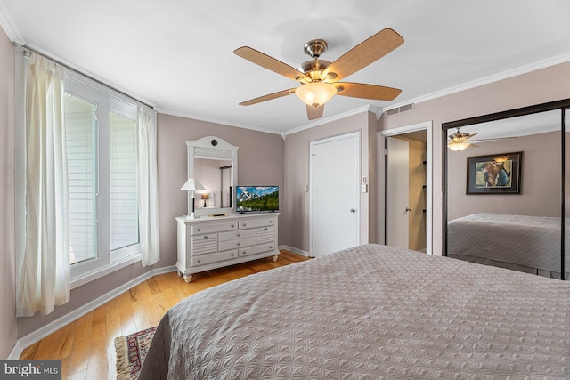 bedroom featuring crown molding, ceiling fan, and light hardwood / wood-style floors