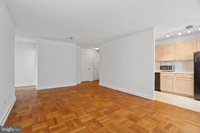 unfurnished living room with light parquet floors