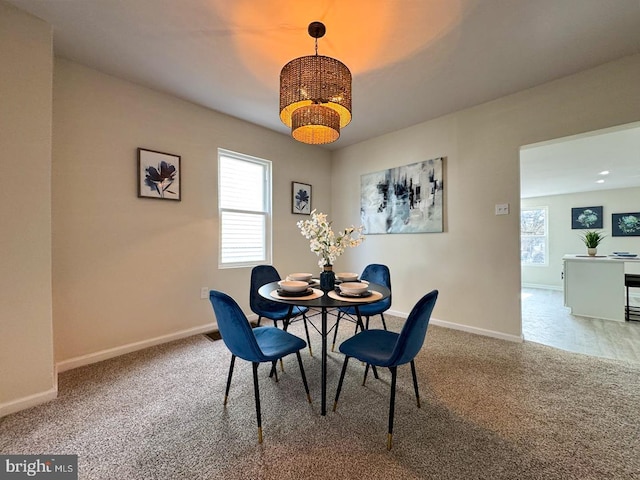 dining space with a healthy amount of sunlight and carpet floors