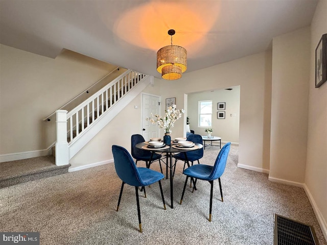 view of carpeted dining space