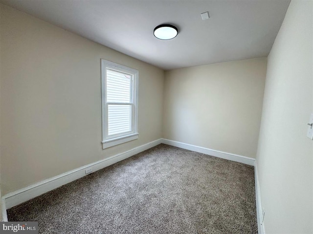 unfurnished room featuring carpet flooring