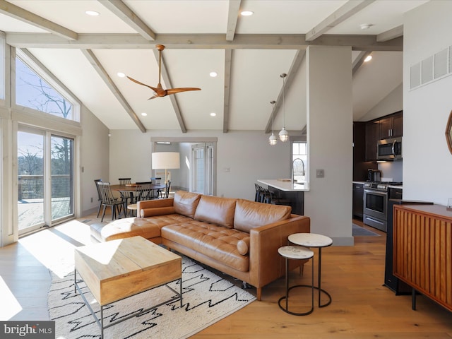 living area with visible vents, light wood-style floors, high vaulted ceiling, beam ceiling, and recessed lighting