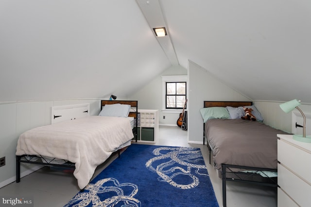 bedroom featuring vaulted ceiling with beams