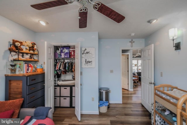 bedroom featuring dark wood-type flooring and ceiling fan