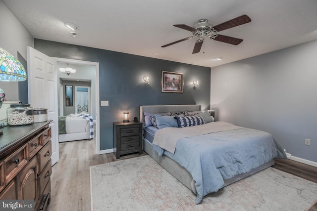 bedroom featuring light hardwood / wood-style floors and ceiling fan