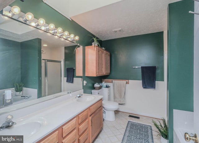 full bathroom featuring tile patterned flooring, vanity, plus walk in shower, a textured ceiling, and toilet