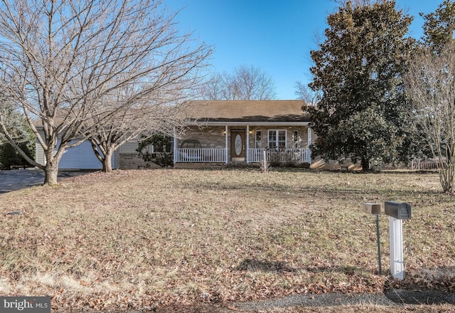 ranch-style house featuring covered porch