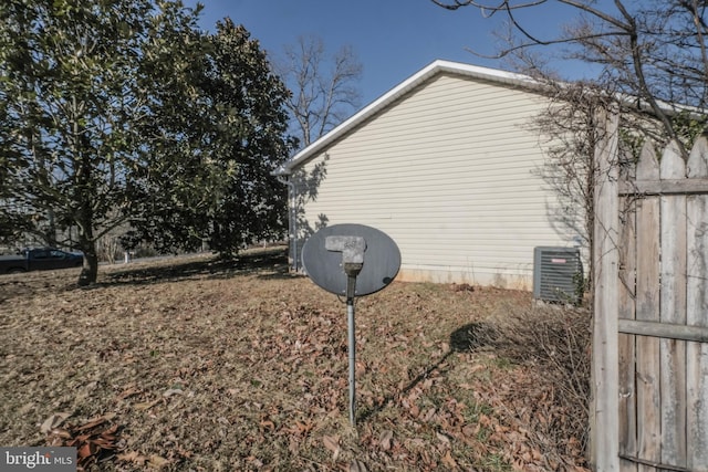 view of side of property featuring central AC