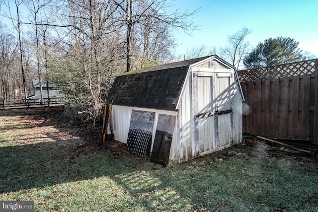 view of outbuilding featuring a yard