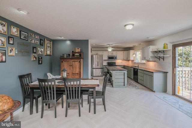 dining space with sink and a wealth of natural light