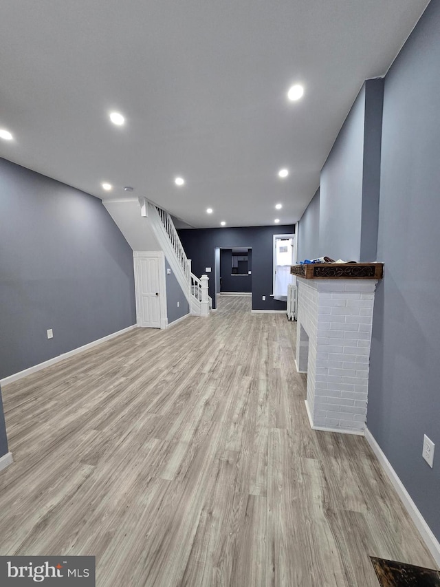 unfurnished living room featuring light hardwood / wood-style floors