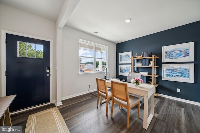 home office featuring dark hardwood / wood-style flooring and beam ceiling