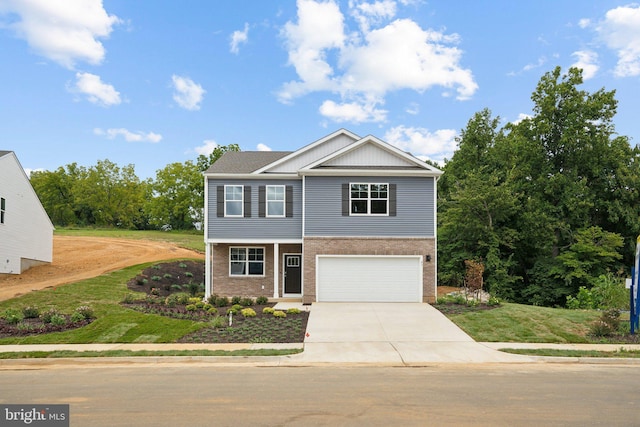 view of front of house with a garage and a front yard