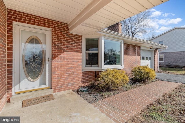 property entrance with a garage